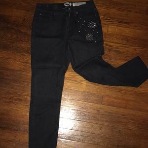 Black ankle  ankle jeans with embellishments on
